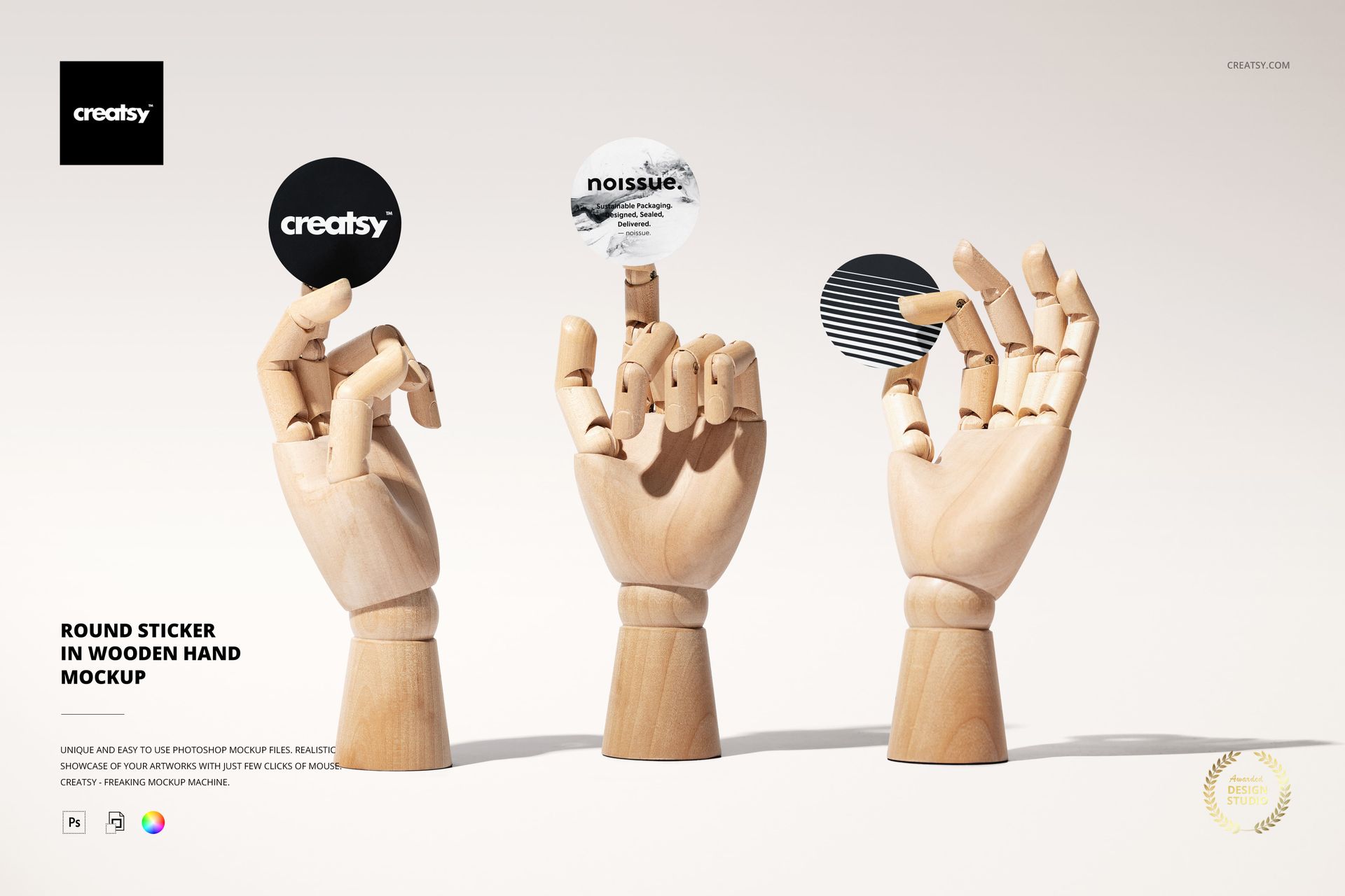 Front view of three wooden hands each displaying a round sticker with unique patterns and colors, PSD mockup scene.