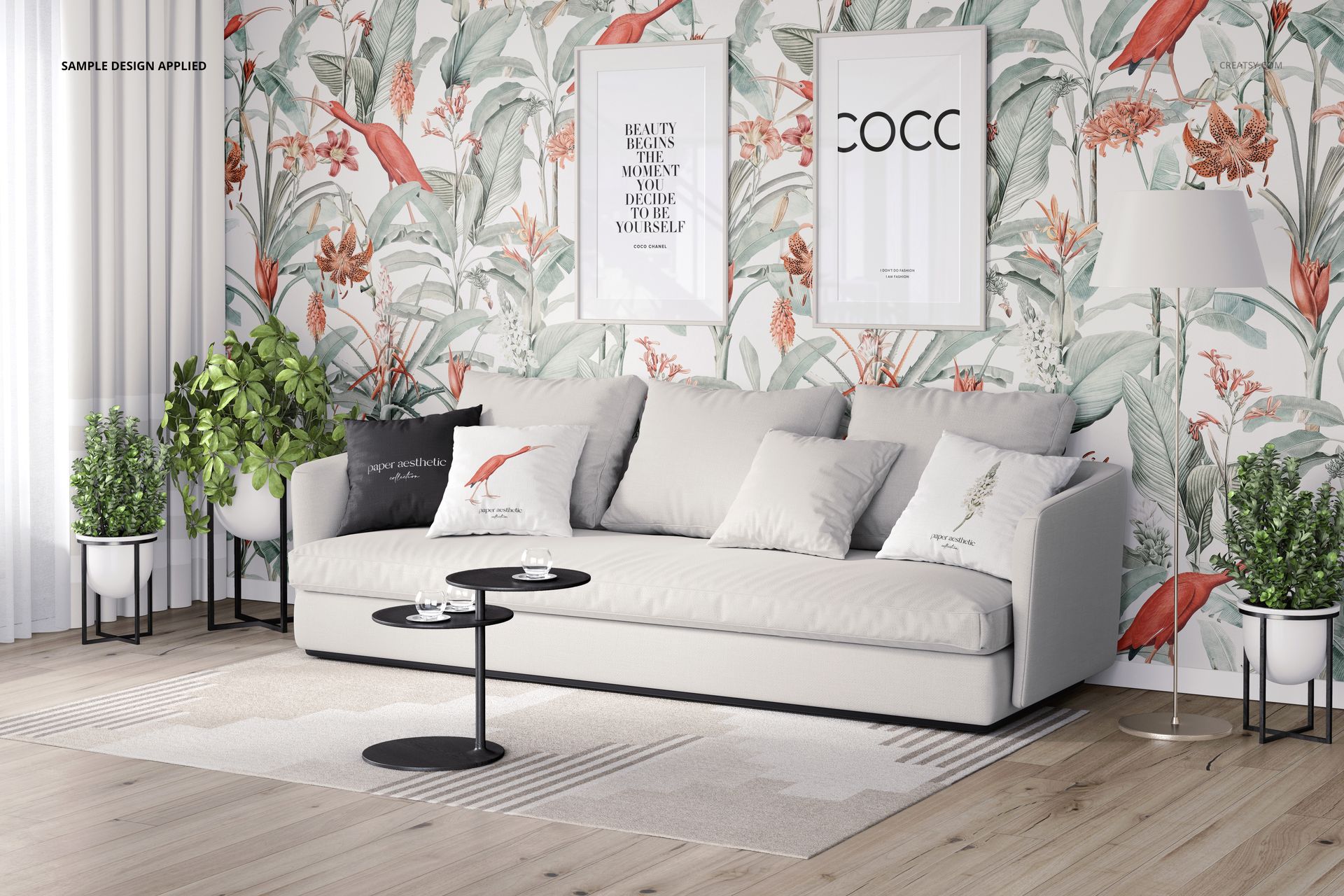 Front view of a stylish interior with a sofa, patterned pillows, and nature-inspired wallpaper in a PSD mockup.
