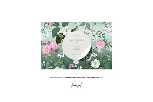 Sewing kit and cotton ribbon mockup featuring a round ribbon spool on a floral patterned background, front view.