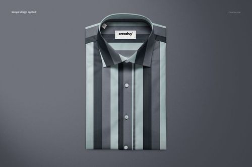 Folded dress shirt mockup featuring a striped pattern in gray and blue tones, viewed from above on a plain surface.