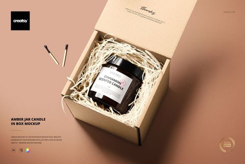 Top view of a brown glass jar candle with matches, presented in an open box on a neutral background for PSD mockup use.
