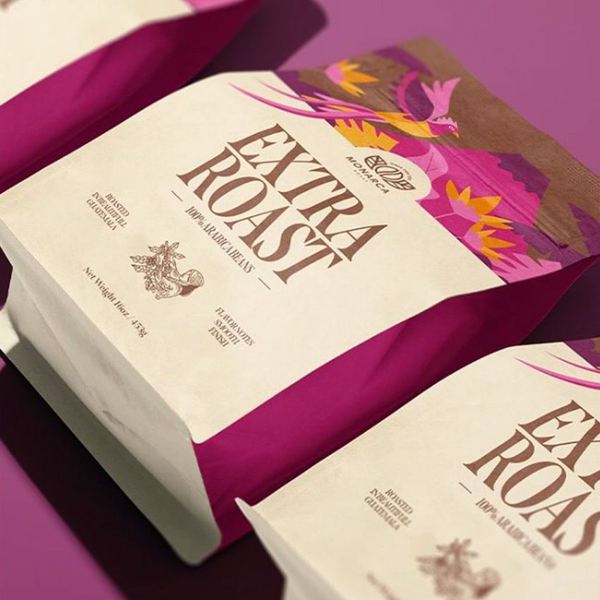 Coffee bag mockup featuring a vibrant magenta and cream design with illustrated mountain scenery and bold text overlay.