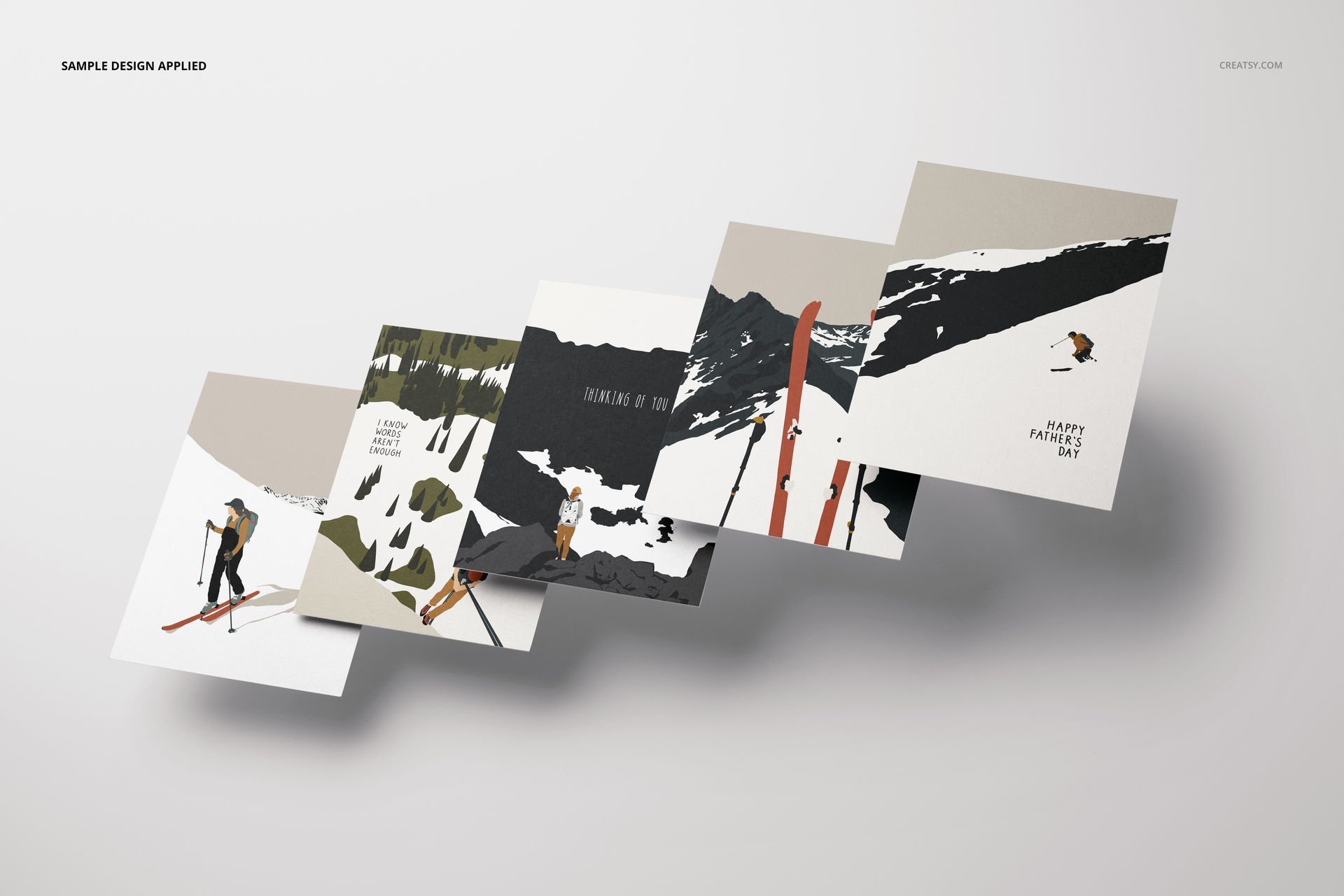 A2 card mockup set showing five cards with winter sports artwork, arranged in a diagonal layout on a light surface.