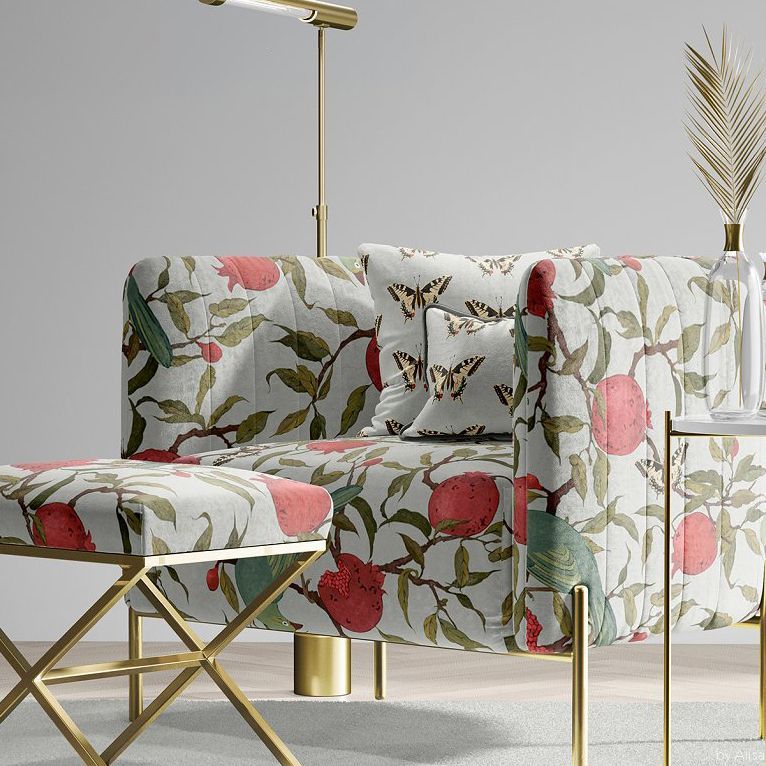 Velvet armchair and matching stool mockup with a vintage garden pattern featuring fruit, leaves, and butterflies in a modern room.