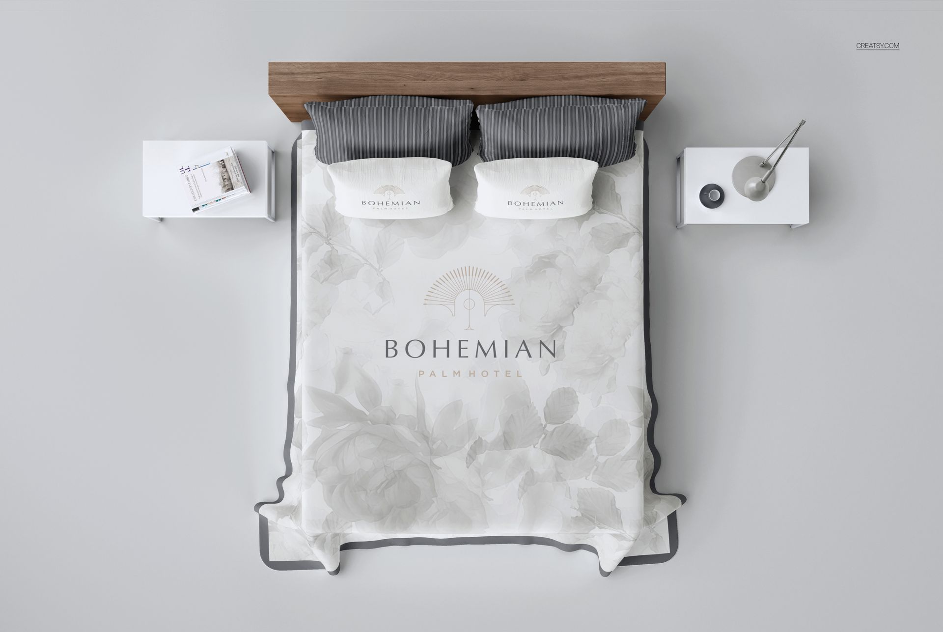 PSD mockup showing a double bed with a floral-patterned quilted coverlet, striped pillows, and minimal bedside tables.
