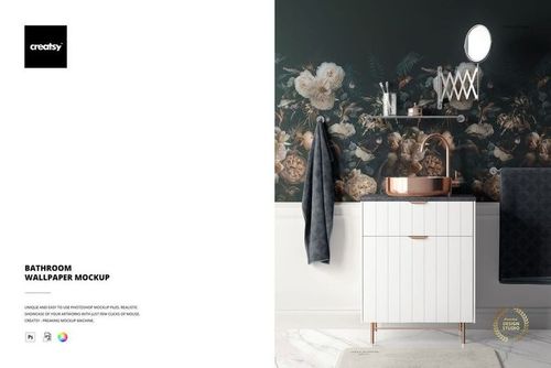 Front view of a bathroom wallpaper mockup showing floral patterned wall behind a white vanity, round mirror, and two hanging towels.