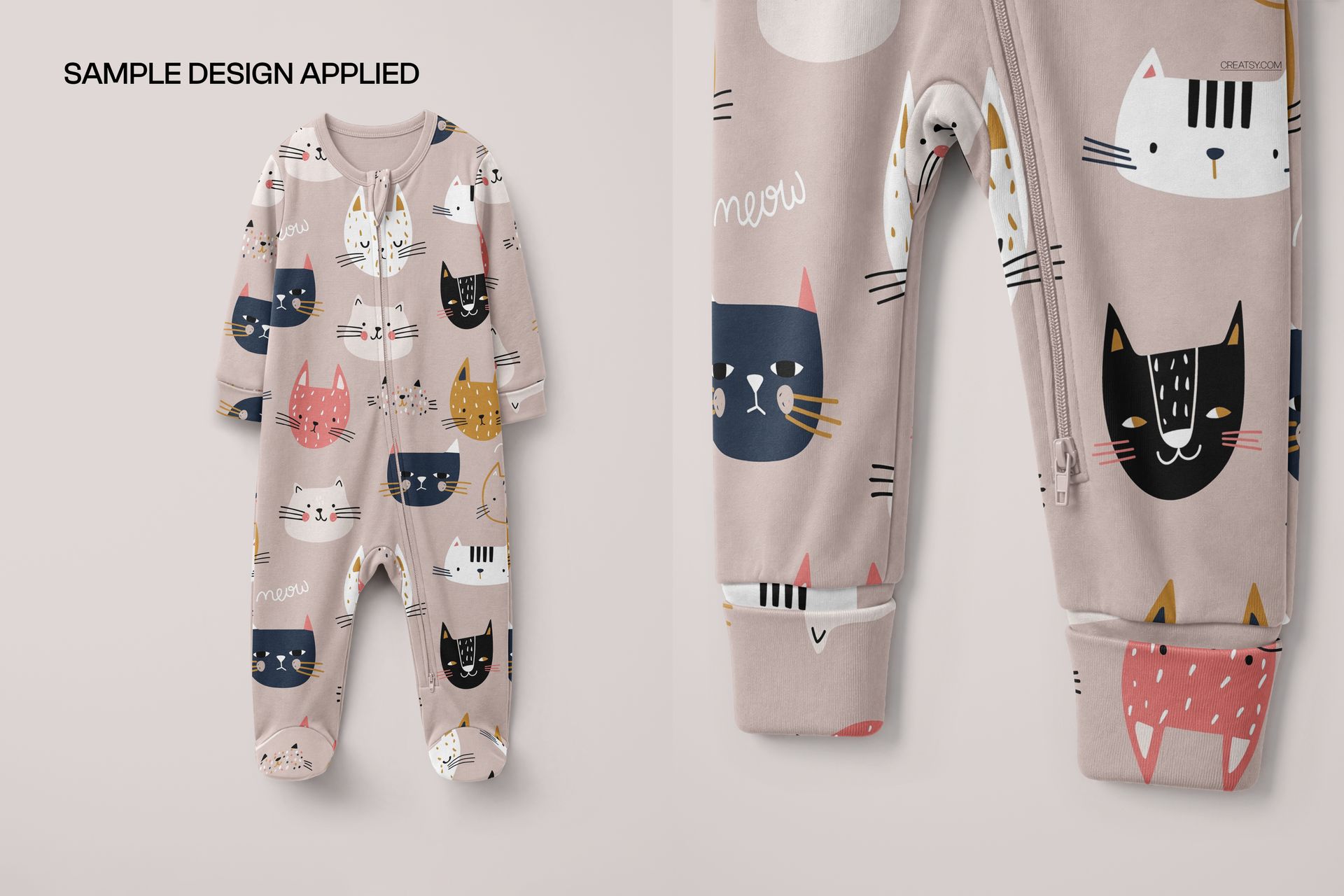 Front view of a baby sleepsuit mockup with cuffed sleeves, featuring a playful cat pattern in pastel colors.