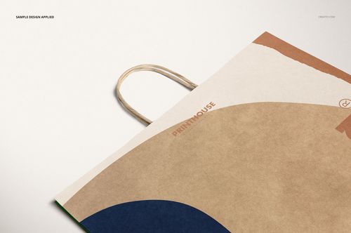 Kraft paper shopping bag mockup shown from a close-up perspective with curved color accents and neutral tones.
