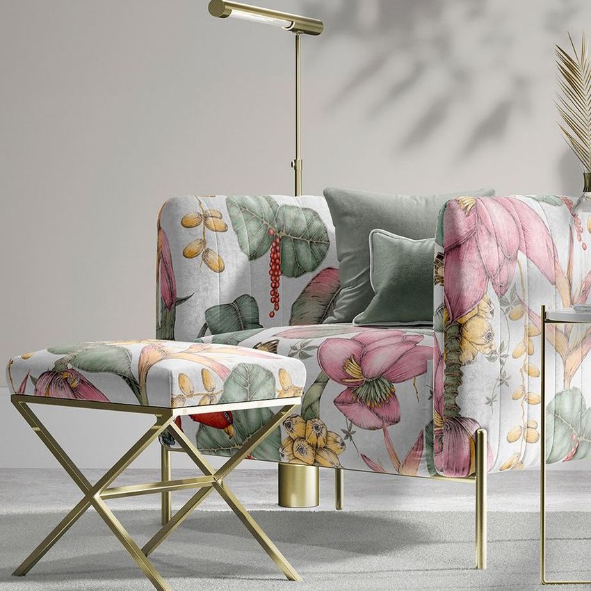 Velvet armchair and stool mockup featuring a large floral pattern in pink, green, and yellow tones on a light background.