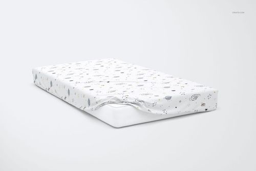 PSD mockup of a kids bed sheet with whimsical star and planet designs, displayed on a mattress against a light background.