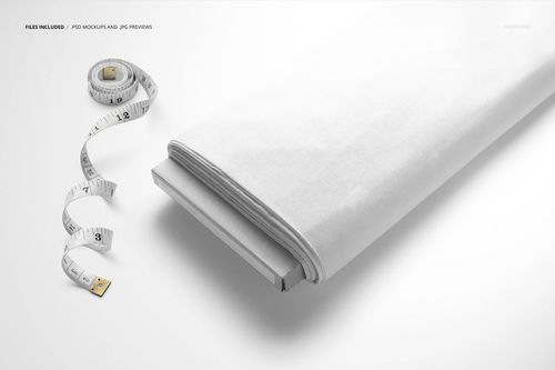 White fabric bolt mockup shown from a top angle, with a measuring tape and USB drive placed nearby on a light background.