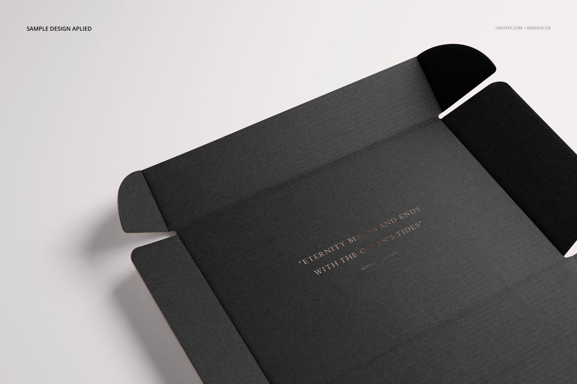 Open black mailing box mockup shown from a top angle, displaying interior gold text and clean, minimal background.