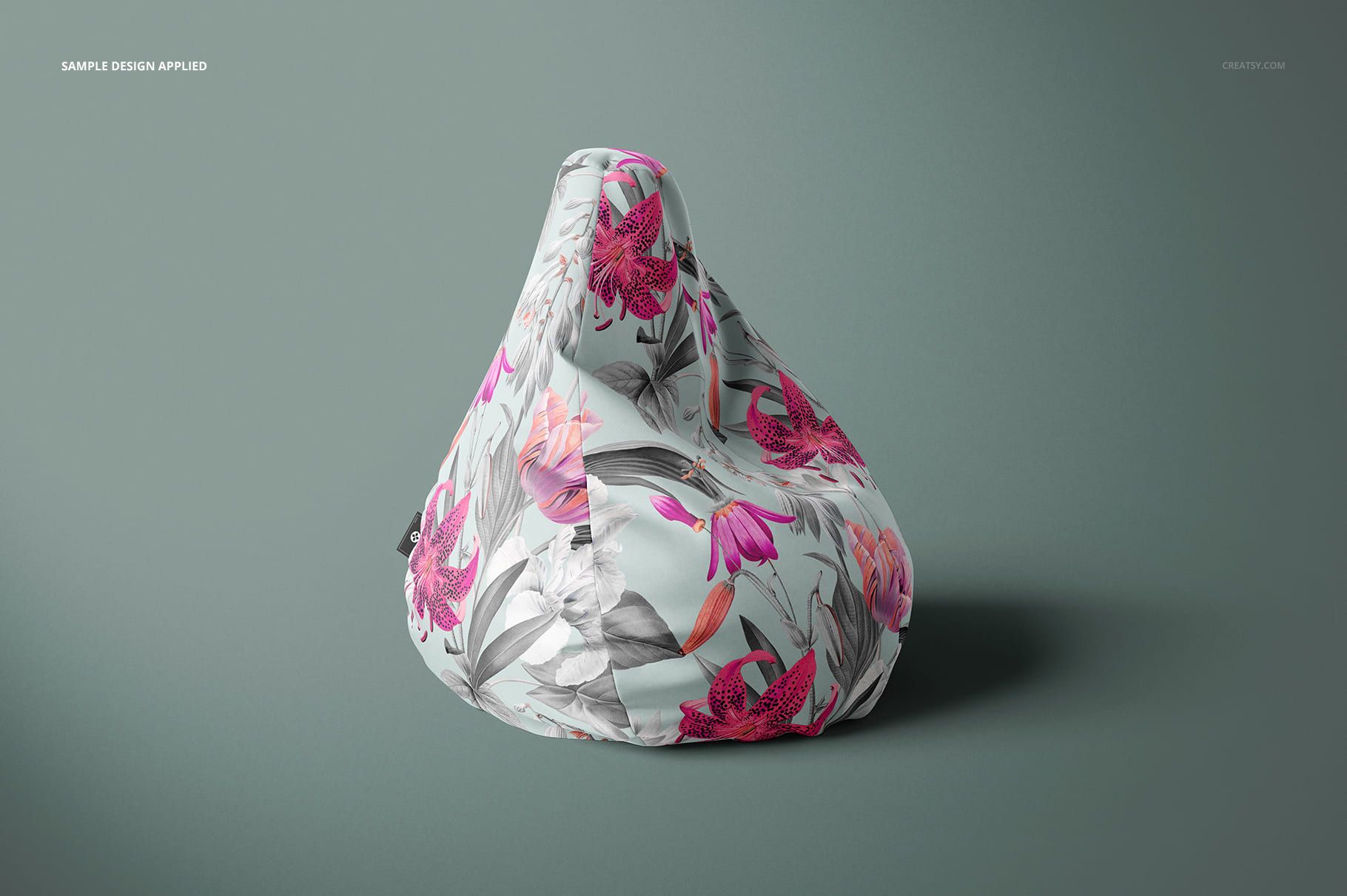 Mockup of a bean bag chair featuring a botanical pattern in pink and gray tones, displayed against a neutral background.