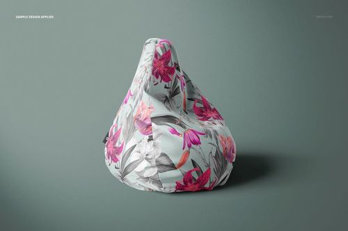 Mockup of a bean bag chair featuring a botanical pattern in pink and gray tones, displayed against a neutral background.