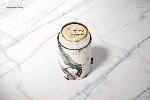 Mockup of a neoprene can cooler featuring botanical leaves and flowers, viewed from above on a marble background.