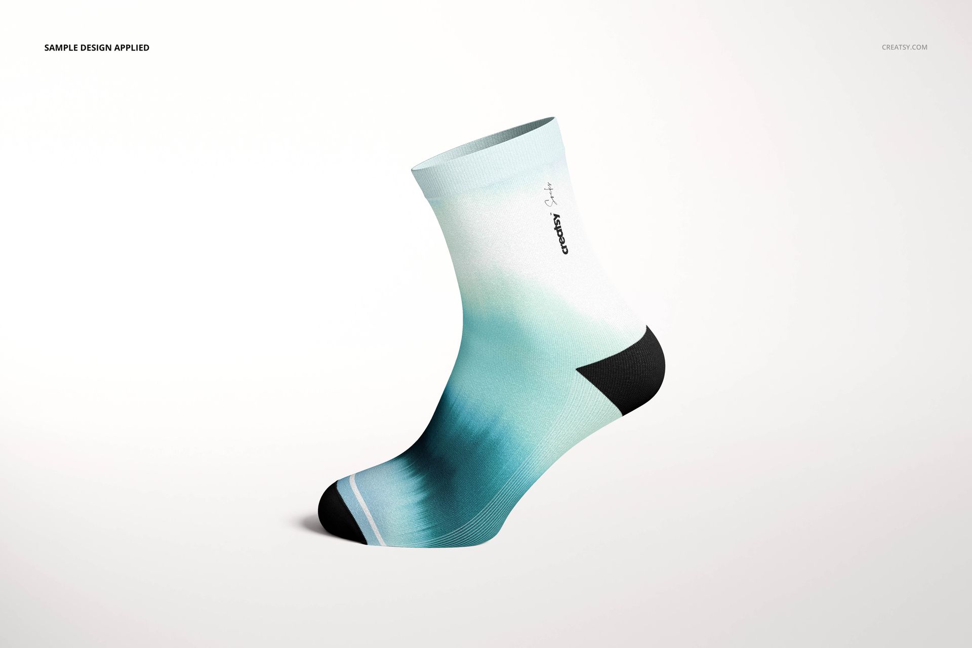 Short sock mockup with a gradient teal and white pattern, black heel and toe, shown in side view on white background.