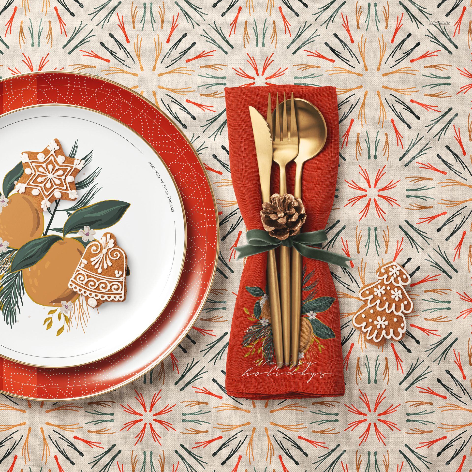 Christmas-themed table setting with decorated plate, red napkin holding gold cutlery, and festive gingerbread cookies.