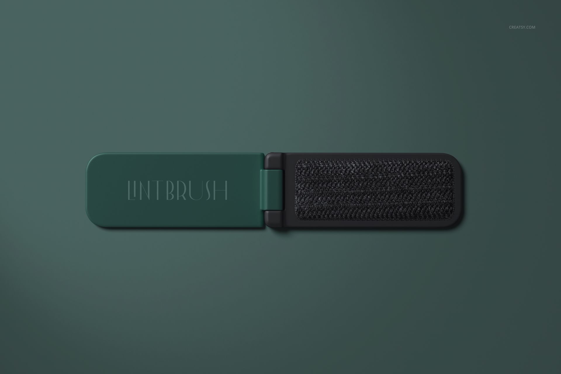 Open folding lint brush mockup set on a solid green background, showing textured bristles and sleek casing.