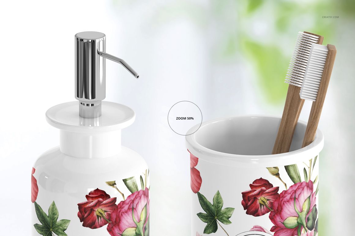 Front view of bath accessories mockup set with floral pattern, featuring a soap dispenser and toothbrush holder.