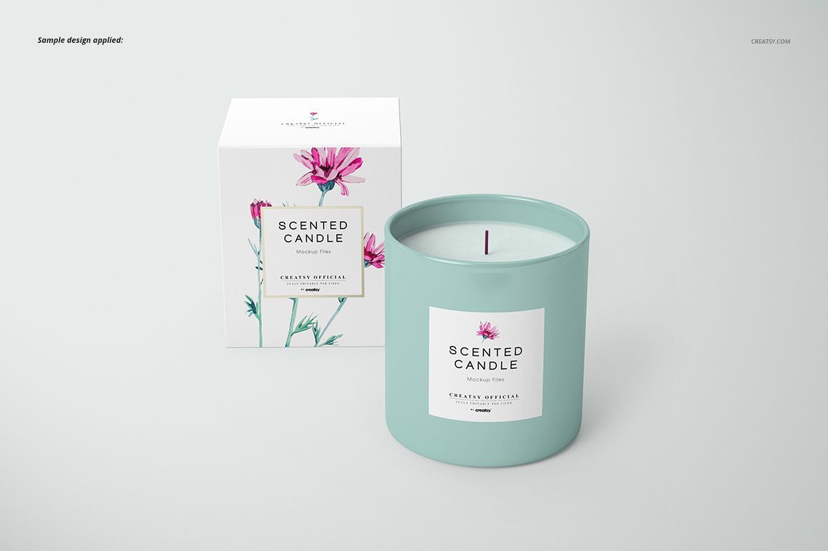 Front view of a classic candle and matching box mockup, featuring a pastel blue candle jar and floral label design.