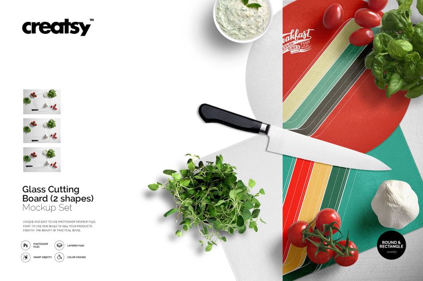 Glass cutting board mockup set featuring round and rectangular boards, fresh herbs, tomatoes, and a kitchen knife on a white surface.