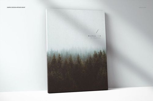 Front view of a thick canvas print mockup with a misty forest design, standing against a light wall background.