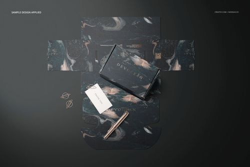 Mailing box mockup with dark abstract pattern, shown from top view with unfolded packaging and stationery props.