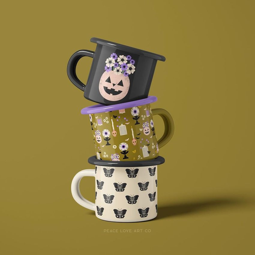 Stack of three enamel mug mockups with Halloween and butterfly designs, arranged vertically on a solid olive background.