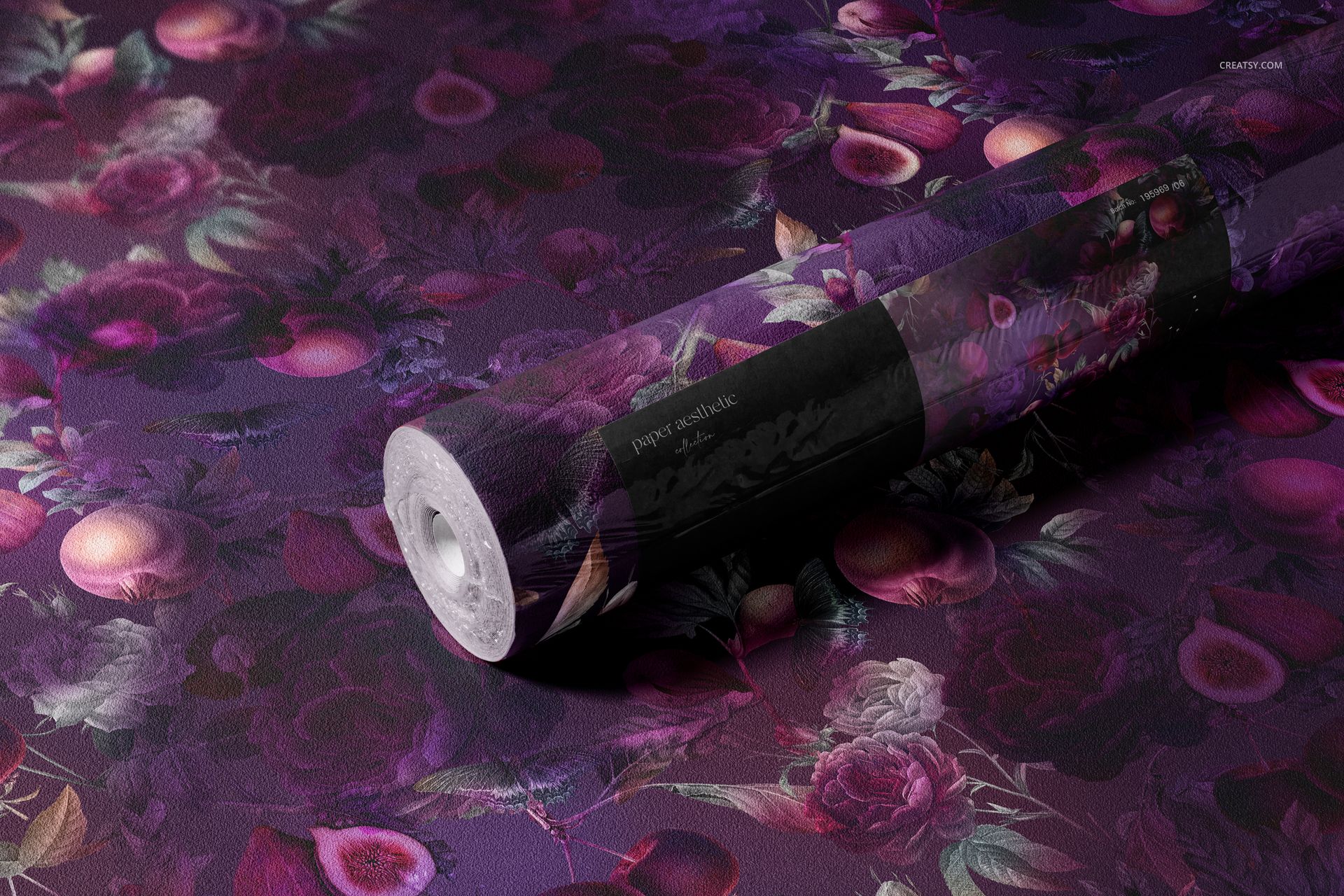 Mockup of a non-woven vinyl wallpaper roll featuring a detailed purple and pink botanical design on a flat surface.