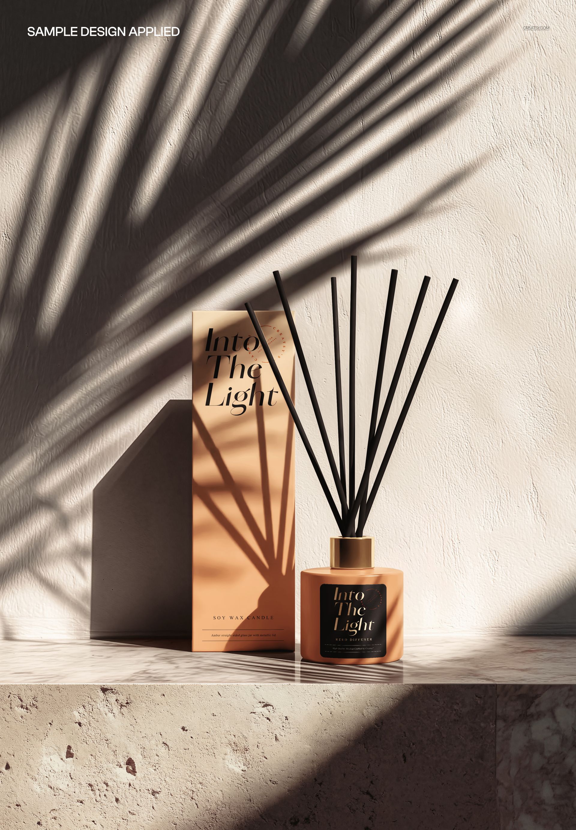 PSD mockup showing a reed diffuser bottle and box on a textured stone pedestal, illuminated by natural light and shadows.