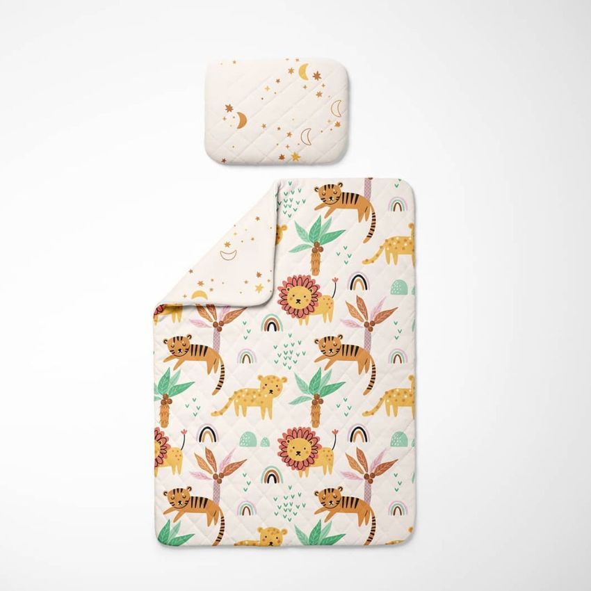 Double-sided baby bedding set mockup featuring a pillow and blanket with safari animal and floral patterns on a white background.
