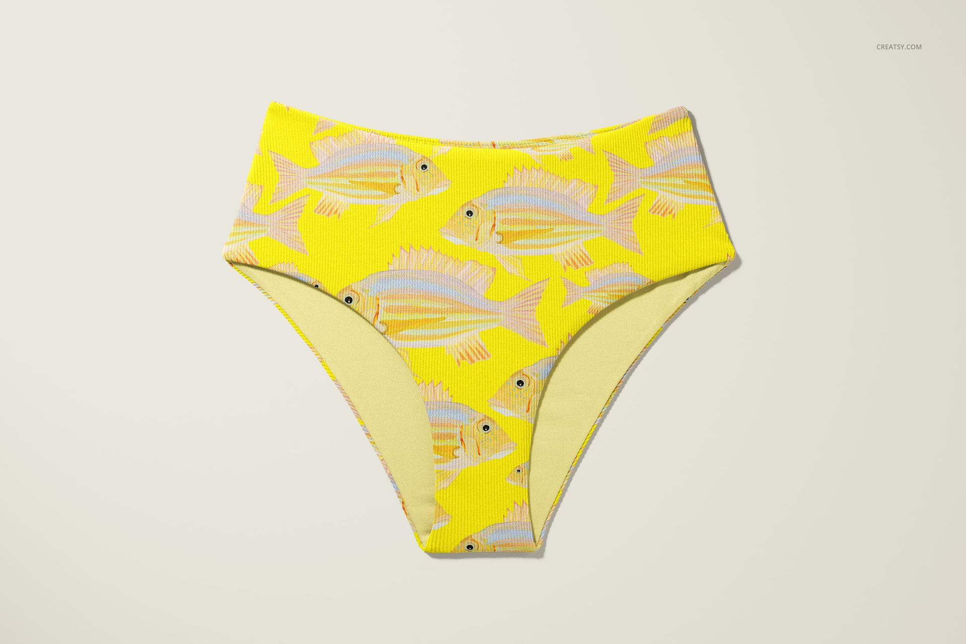 High waisted bikini bottom mockup with a yellow background and fish pattern, shown from the front on a light surface.