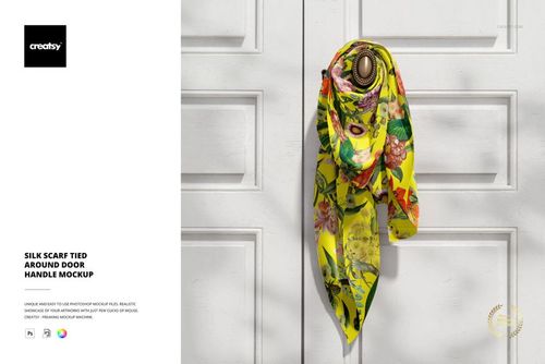 PSD mockup showing a bright silk scarf with multicolored flowers knotted on a decorative door handle, front perspective.