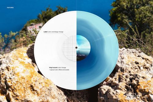 Vinyl record mockup placed on rocky terrain with ocean and greenery in the background, top view perspective.