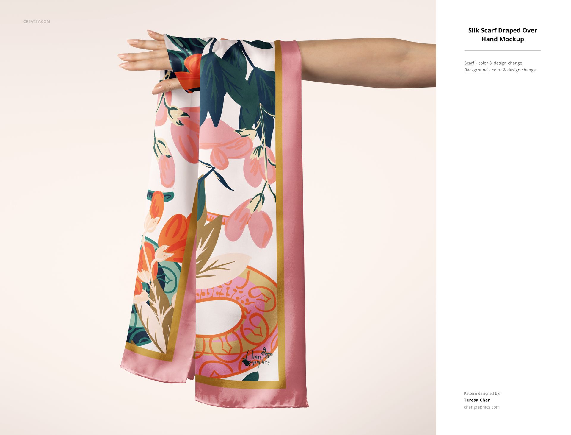 Silk scarf mockup featuring a hand holding a rectangular scarf with pink border and floral pattern, front view.