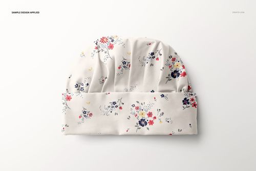Front view of a kids apron mockup with a soft white fabric featuring a delicate floral pattern in red, navy, and yellow.