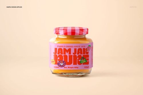 Glass jam jar mockup with a pink patterned lid and vibrant label, displayed against a soft beige surface.