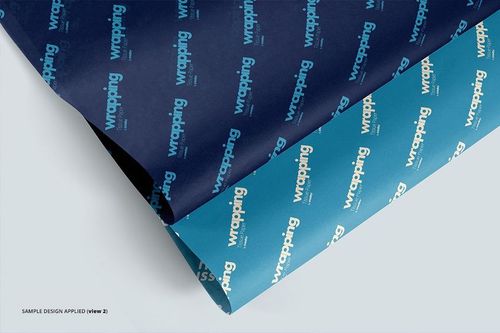 Two sheets of wrapping tissue paper mockup with blue and navy backgrounds, viewed from above on a light surface.