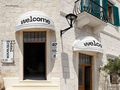 PSD mockup of a hotel entrance with a curved white awning, welcome text, and stone building details in daylight.