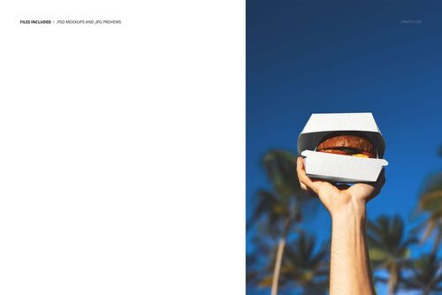 Burger box mockup shown in a hand, featuring a realistic burger and a backdrop of sunny sky and palm trees.