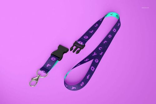 PSD mockup of a detachable lanyard featuring a metal clip and plastic connector, displayed against a purple backdrop.