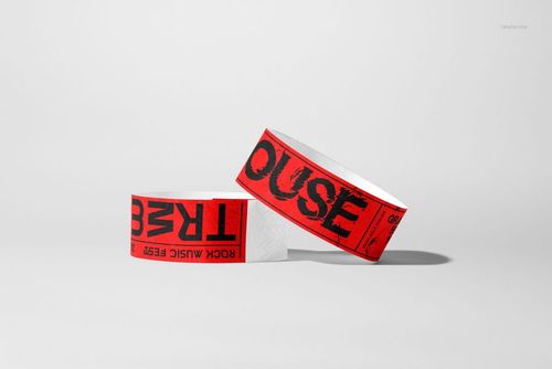 Paper wristband PSD mockup featuring two wristbands with red and black graphics, set against a neutral background.