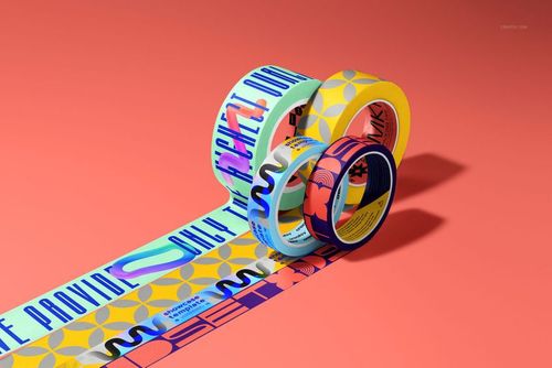 Packaging tape PSD mockup bundle showing multiple patterned rolls with extended tape strips on a pink-orange background.