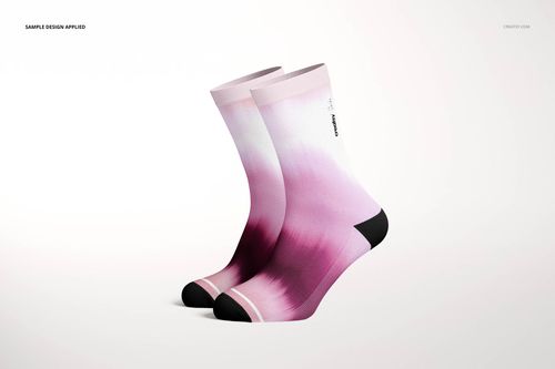 PSD mockup of two socks featuring a soft pink and white gradient design, displayed from a side angle on a white surface.