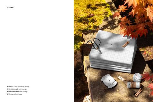 PSD mockup showing layered fabric samples on a stone ledge, with autumn foliage and thread spools in the scene.