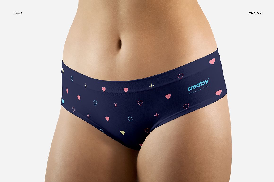 Close-up of a women's briefs PSD mockup featuring a dark blue color and multicolored heart and cross pattern.