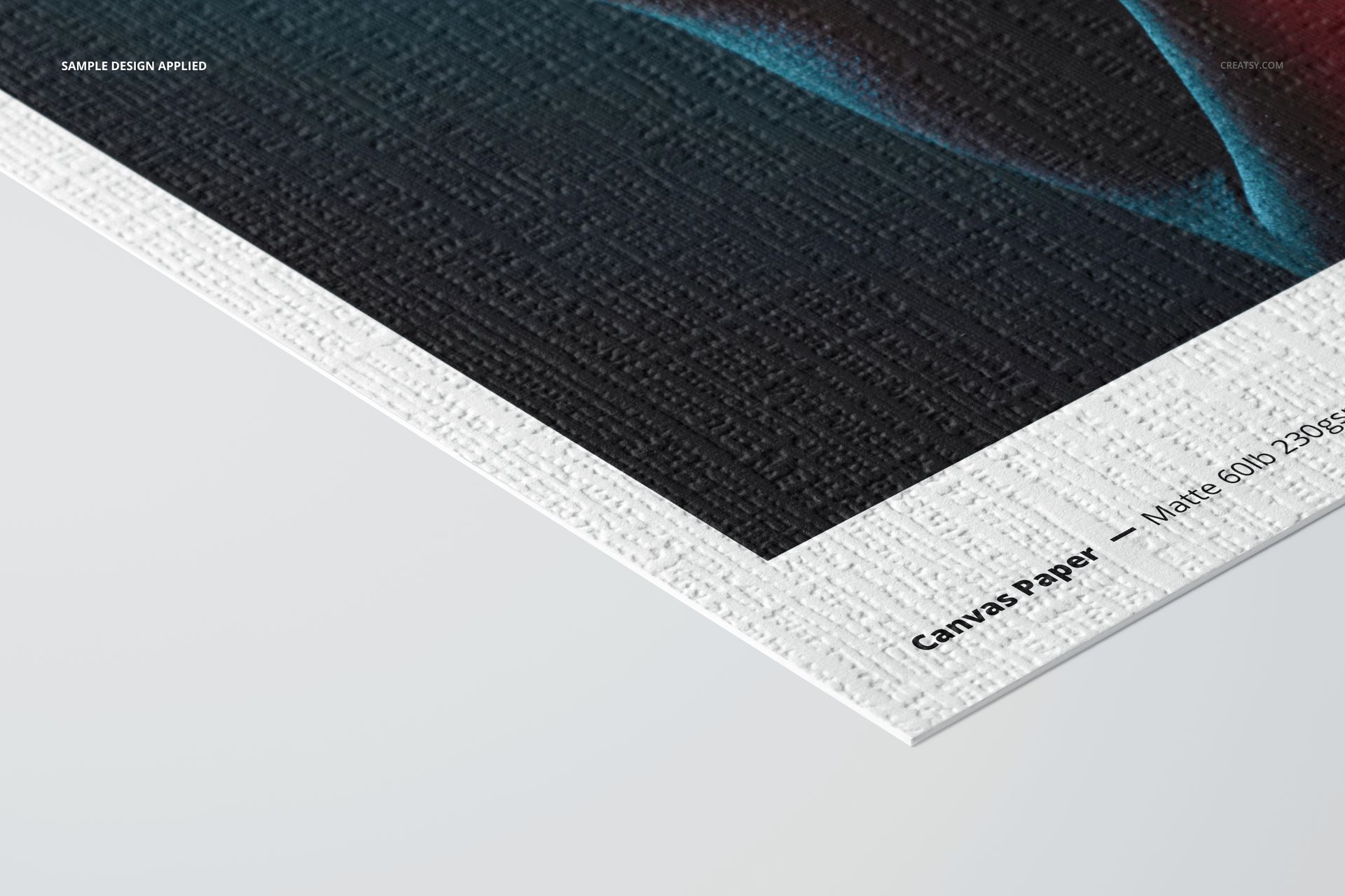 Close-up of a canvas paper mockup featuring a textured white border and matte printed design, angled view.