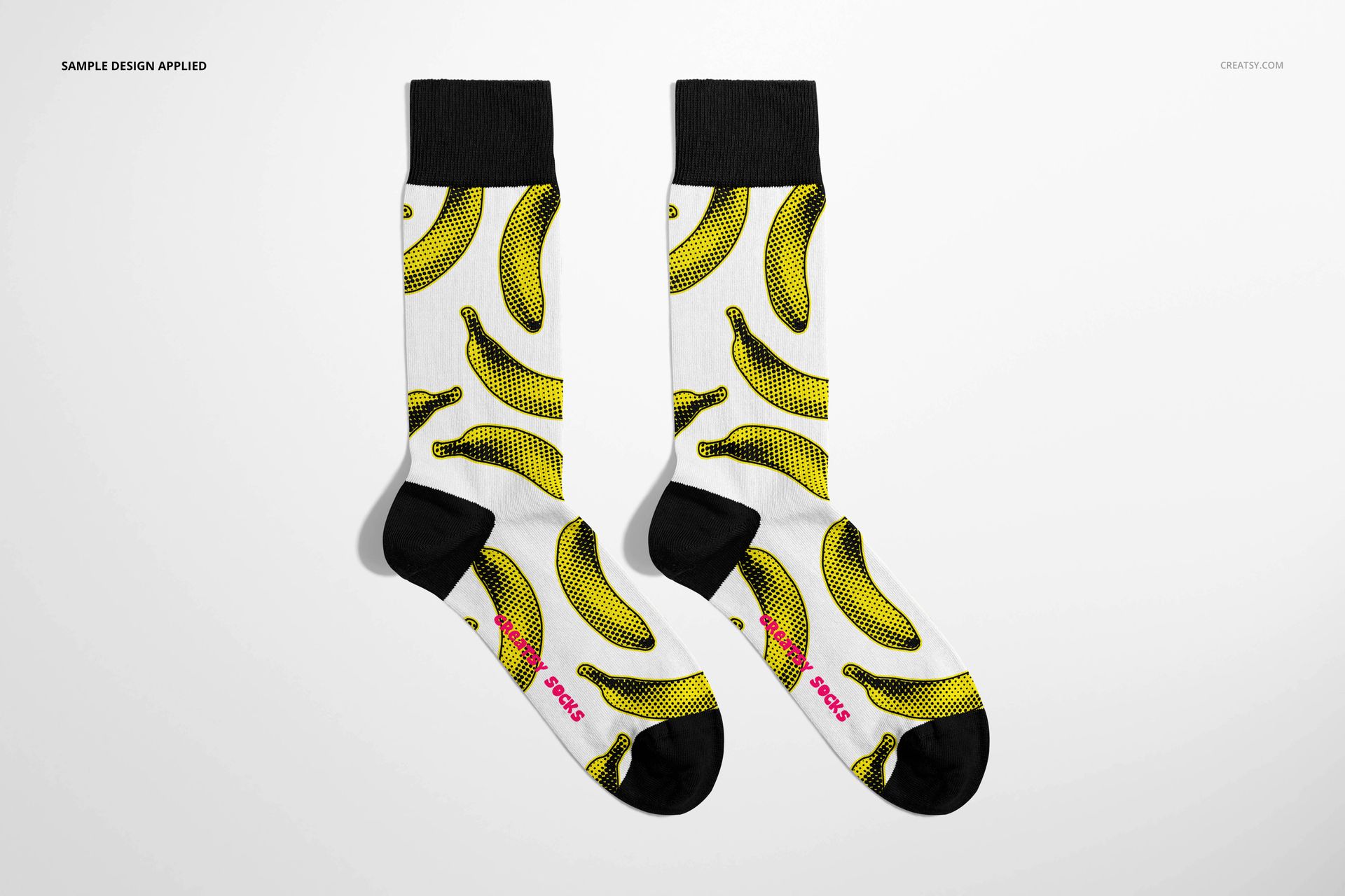 High cuff socks mockup featuring a banana pattern in yellow and black, shown from a front view on a white background.