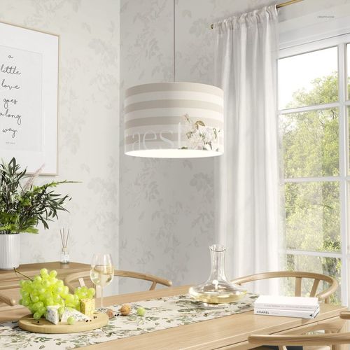 Lamp shade mockup featuring neutral striped design and subtle flowers, suspended in a bright dining area with light decor.