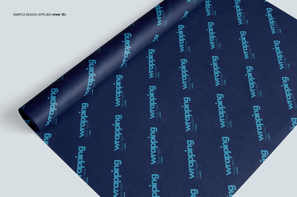 Wrapping tissue paper mockup with a dark blue background and repeating turquoise text, shown in a top angled view.